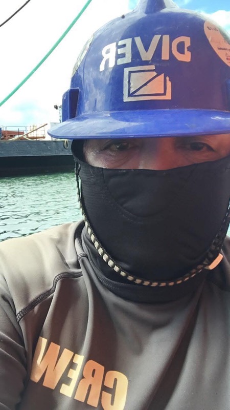 Close-up crew member wearing DIVER helmet and CREW shirt